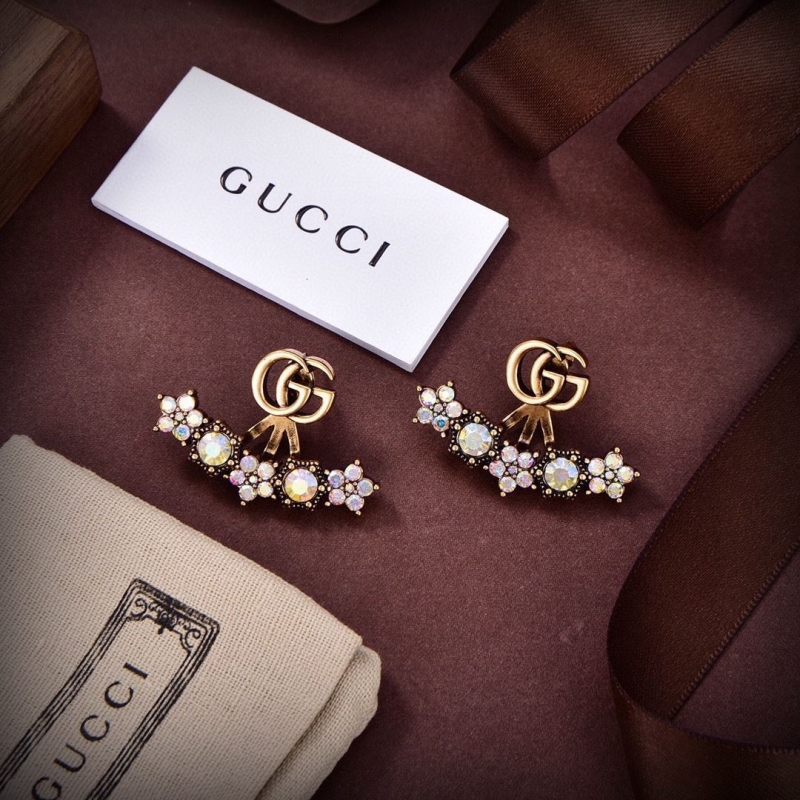 G*u*i earrings